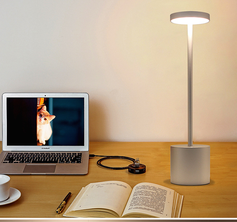 Contemporary aluminum hotel table lamp with minimalist aesthetic